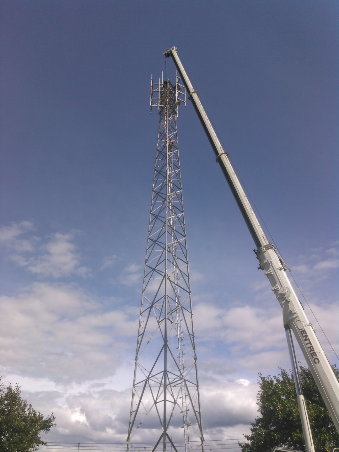 Crane lifting steel section onto a new build tower
